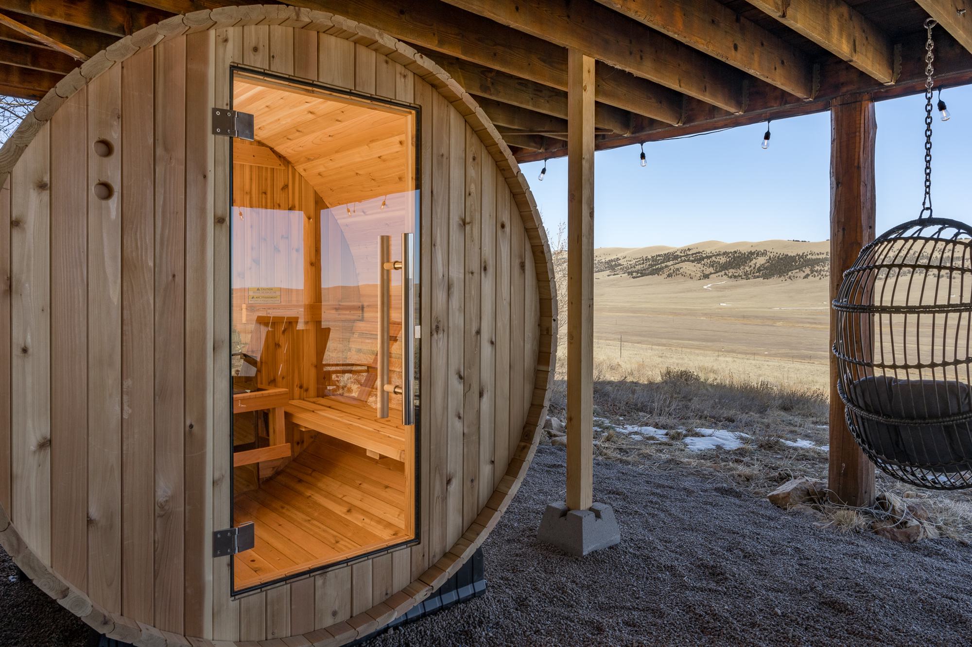 Cedar barrel sauna with mountain views at Skyfall Chalet
