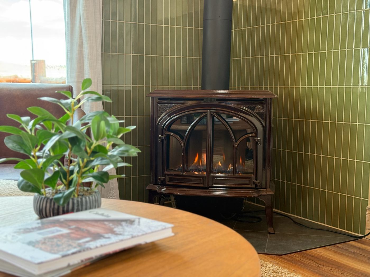 Gas fireplace against olive green tile