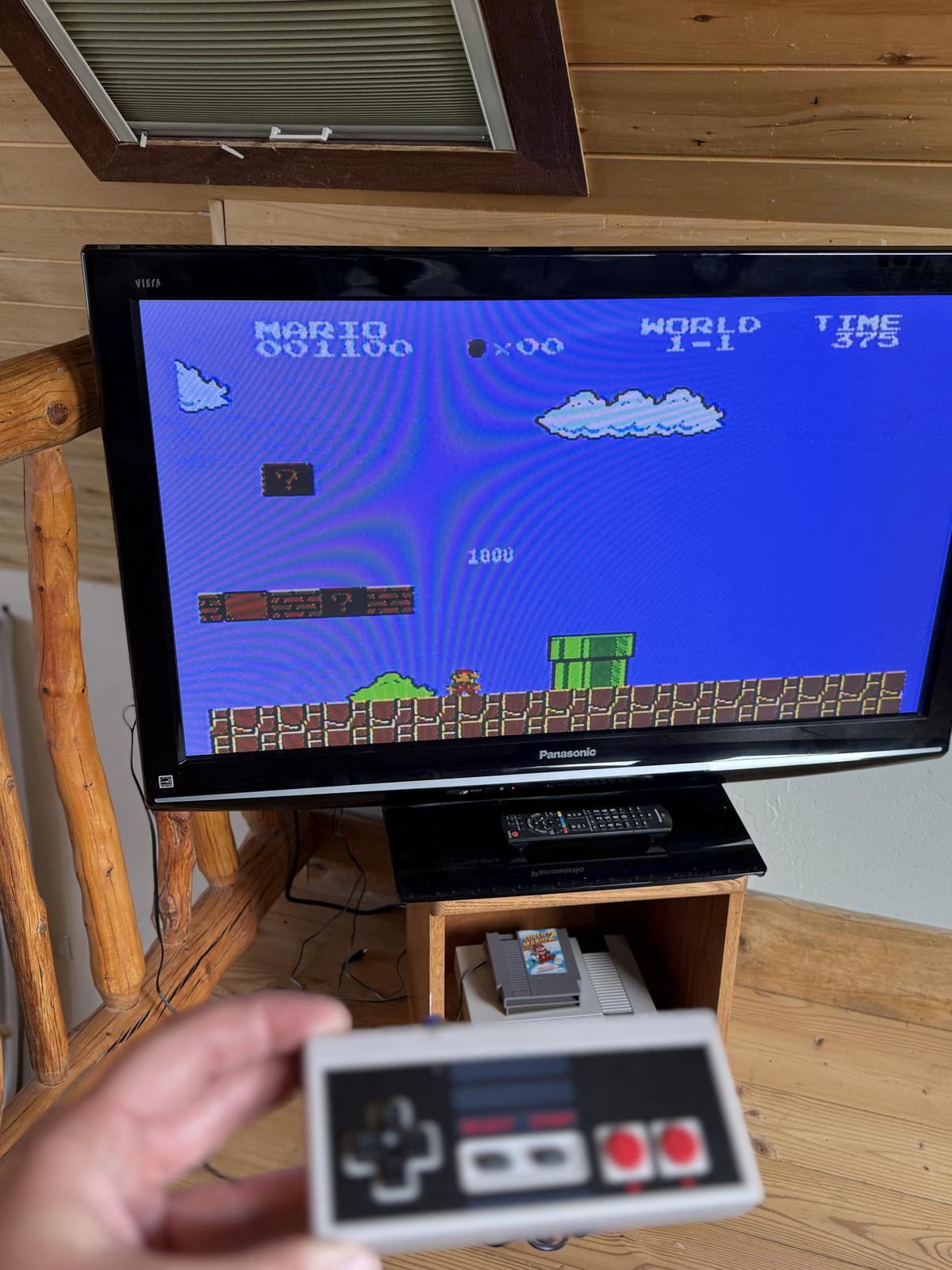 Retro Nintendo playing Super Mario on the TV
